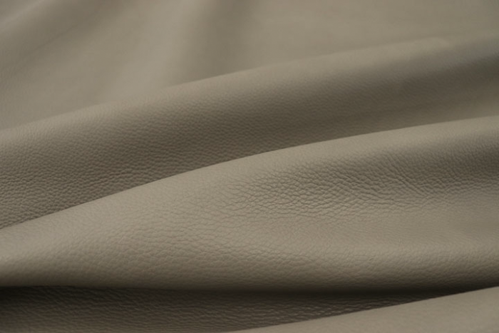 Close up picture of medium grey aniline leather for upholstery