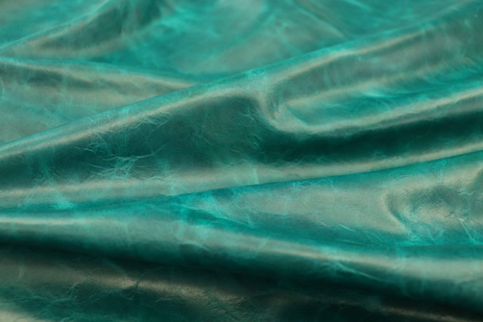 Close up picture of aquamarine pull up upholstery leather