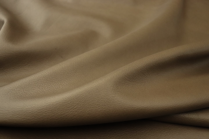 Close up picture of warm mushroom full grain upholstery leather