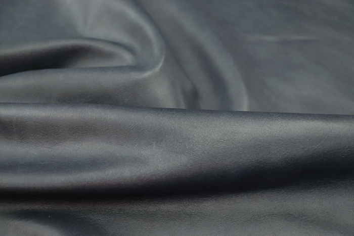 Close up of warm Pacific Blue pull up upholstery leather