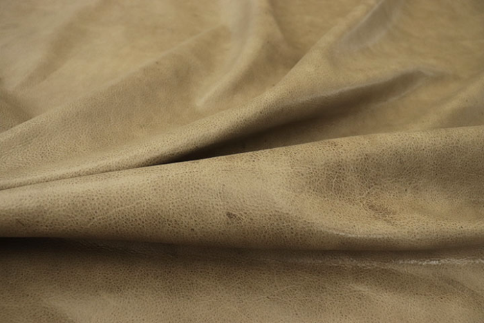 Close up picture of warm taupe aniline upholstery leather