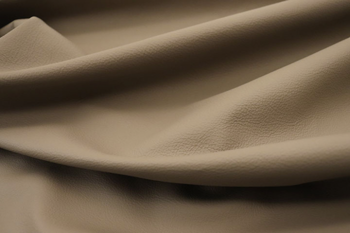 Close up picture of grey taupe Italian upholstery leather