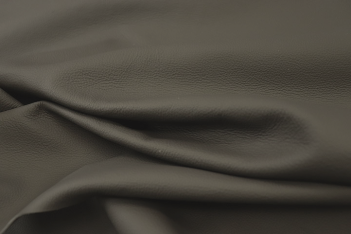 Close up picture of charcoal grey full grain leather for upholstery