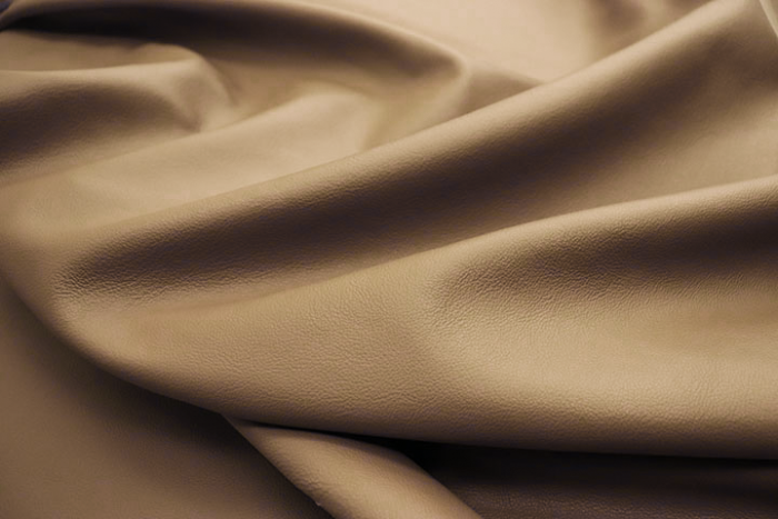 Close up picture of warm oat pebble leather for upholstery