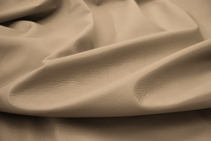Close up of warm sand Italian upholstery leather