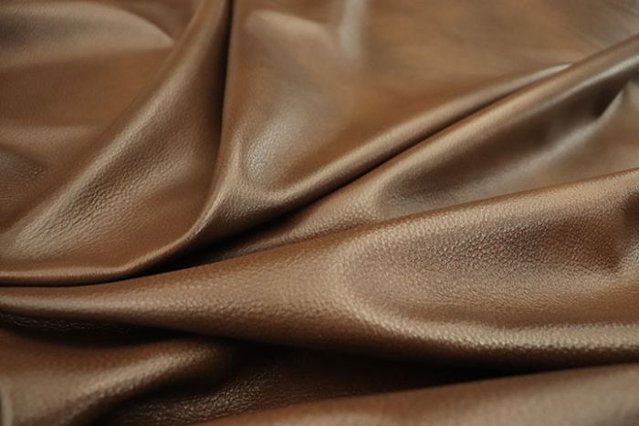 Close up of multi tone warm brown full grain leather for upholstery