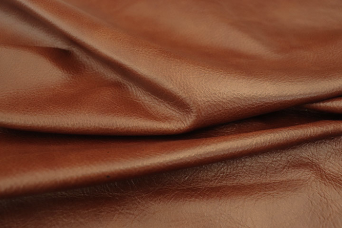 Close up of rich multi tone brandy full grain upholstery leather