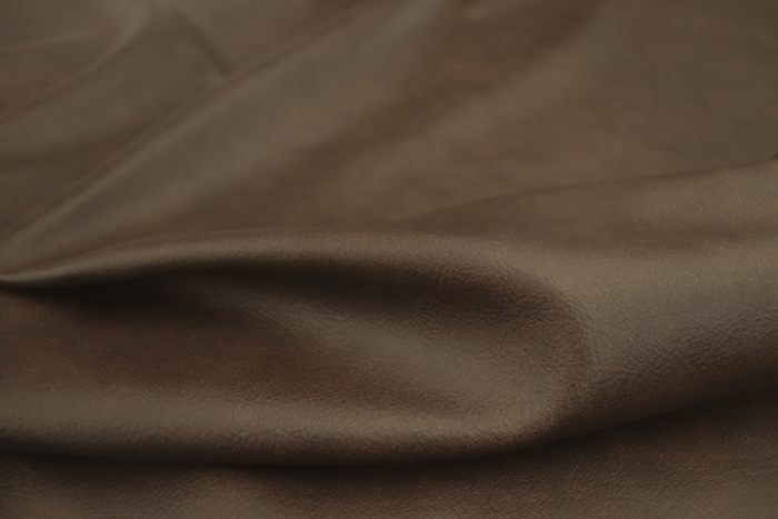 Close up of dark brown multitone Italian upholstery leather