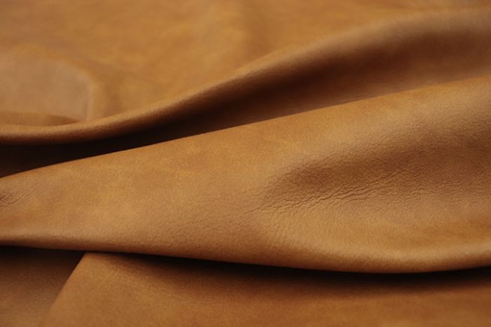 Close up picture of multitone gold Italian upholstery leather