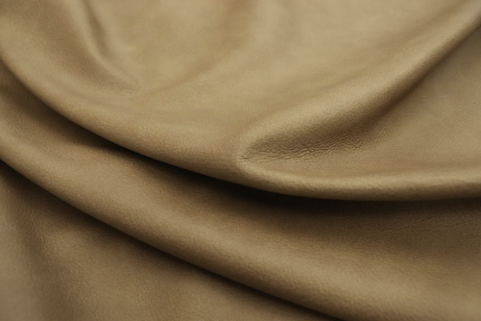 Close up of taupestone semi-aniline leather for upholstery