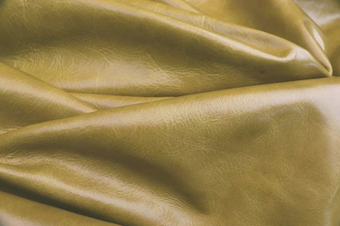 Picture showing the characteristics of a warm pistachio distressed leather hide