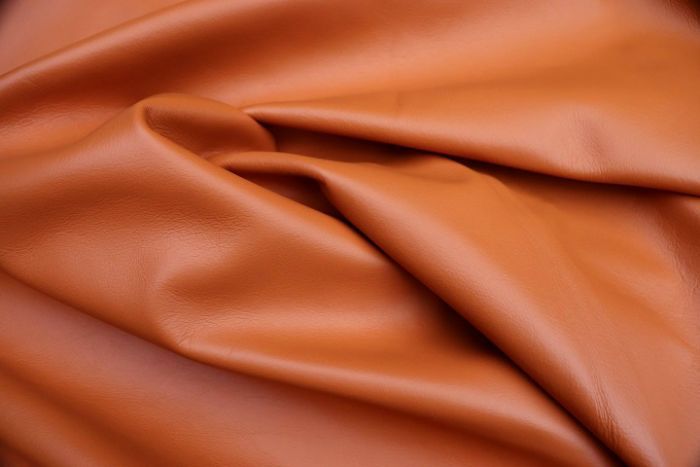 Picture showing the characteristics of an orange Italian leather hide