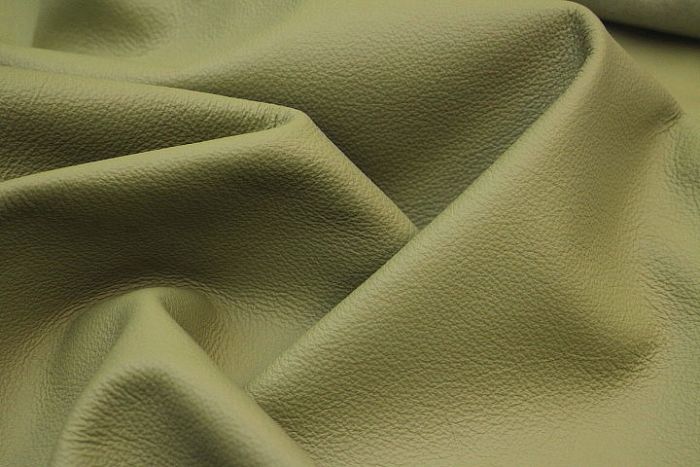 Close up picture of light green leather for upholstery