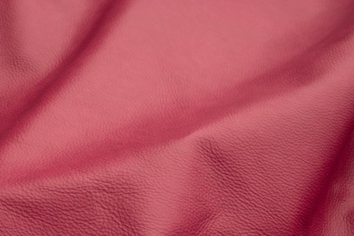 Close up of Raspberry pink semi aniline upholstery leather