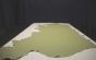 Light green genuine leather cowhide laying flat on a table 