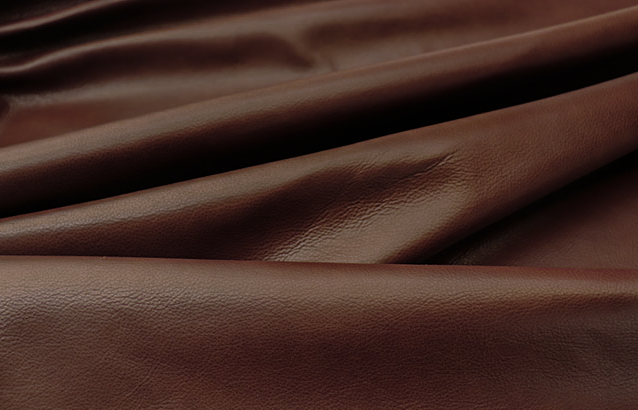 Picture showing the characteristics of dark sienna brown top grain leather hide