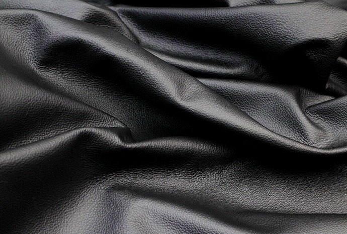 Close up picture of black leather for upholstery 