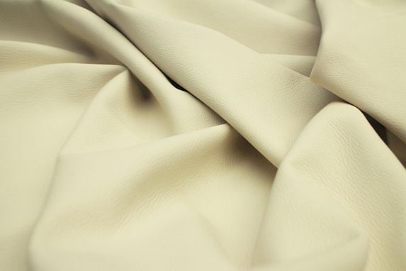 Close up picture of ivory leather for upholstery