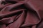 Close up picture of burgundy leather for upholstery