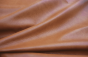 Closeup picture of Hangin in Harlem soft, cognac brown colored upholstery leather for furniture