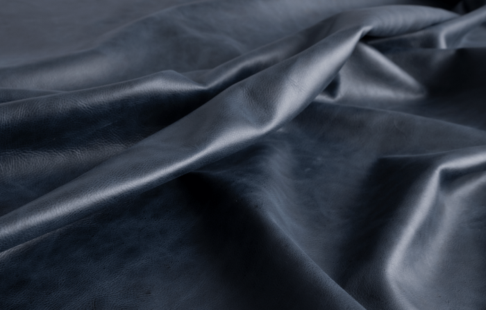 Close up of navy blue aniline dyed upholstery leather